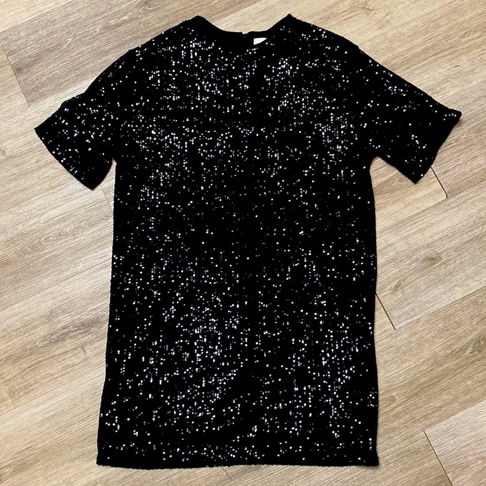 Beautiful black sequin short sleeve dress. Never worn.